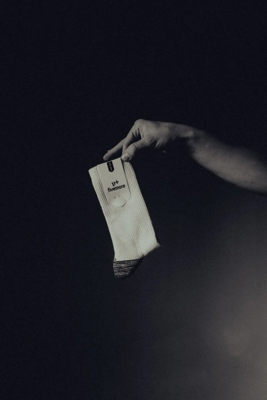 The packaged pair suspended in the dark
