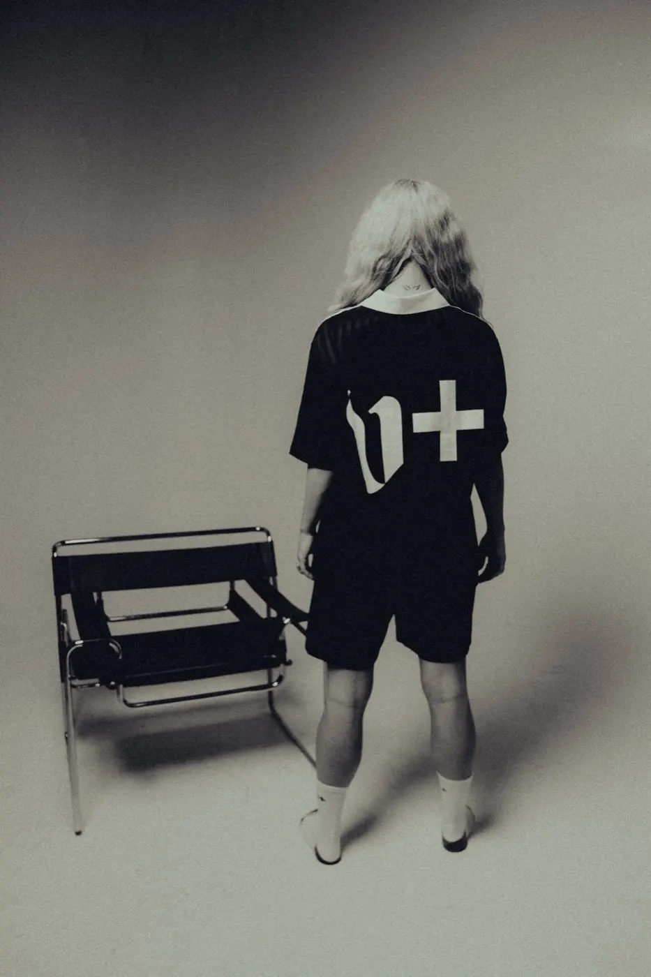 The v+ mark, worn from behind